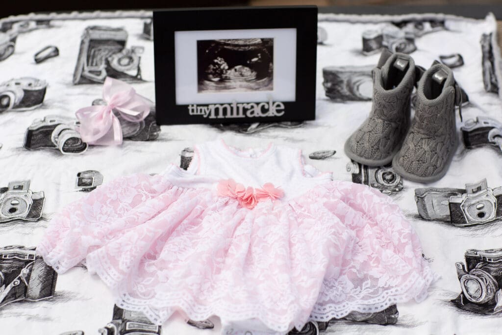 ultrasound photo with baby girl shoes