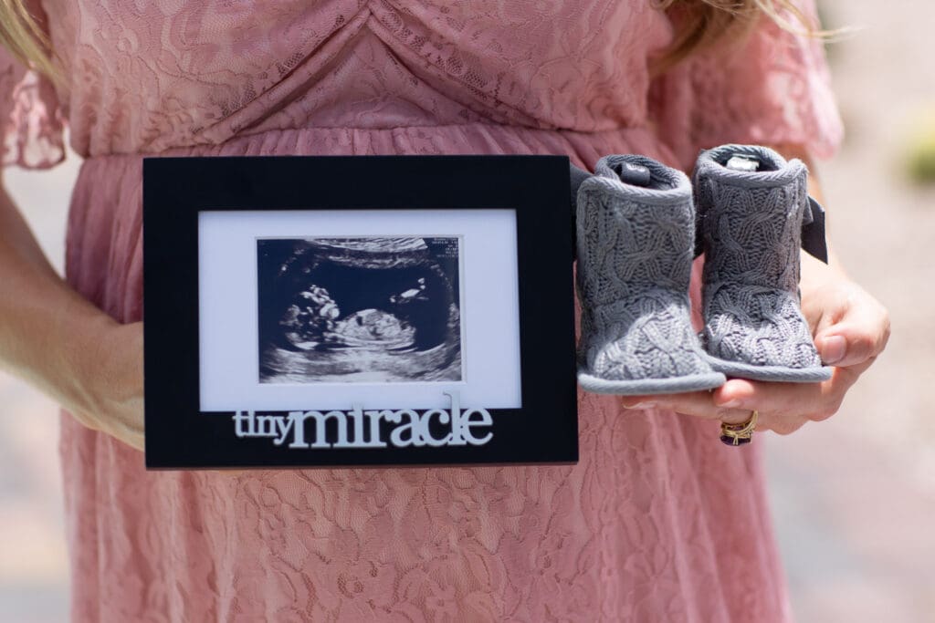 ultrasound photo with baby girl shoes